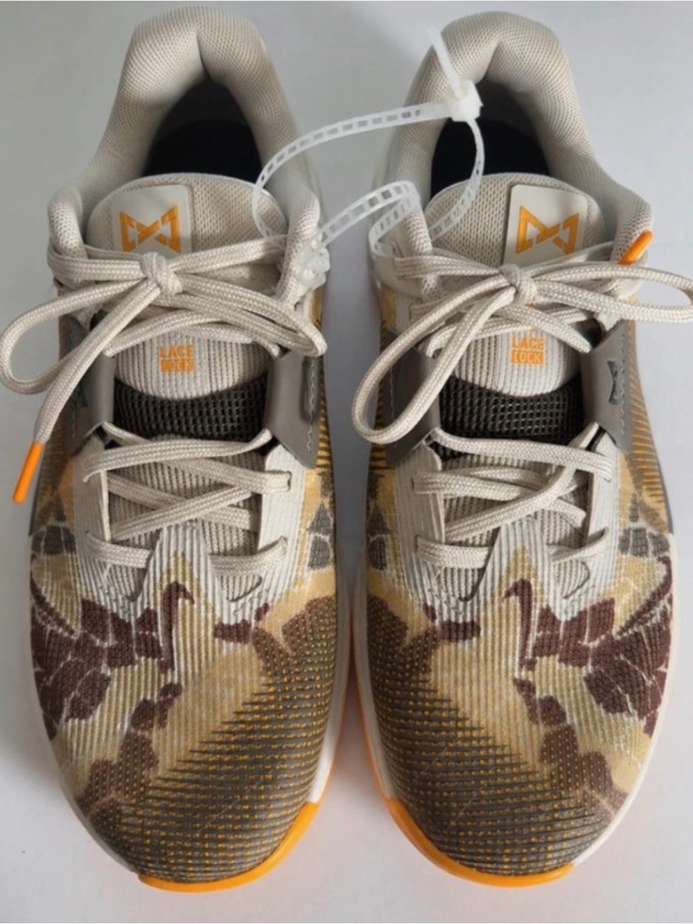 Nike Kids Beige and Brown Patterned Sneakers with Orange Accents